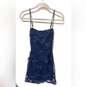 Navy blue, with flower lace. Perfect for a wedding, hoco and winter formal.